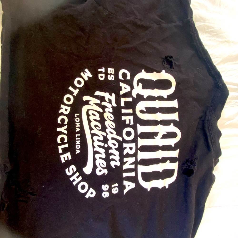 Quaid Harley Davidson motorcycle shop cloths.